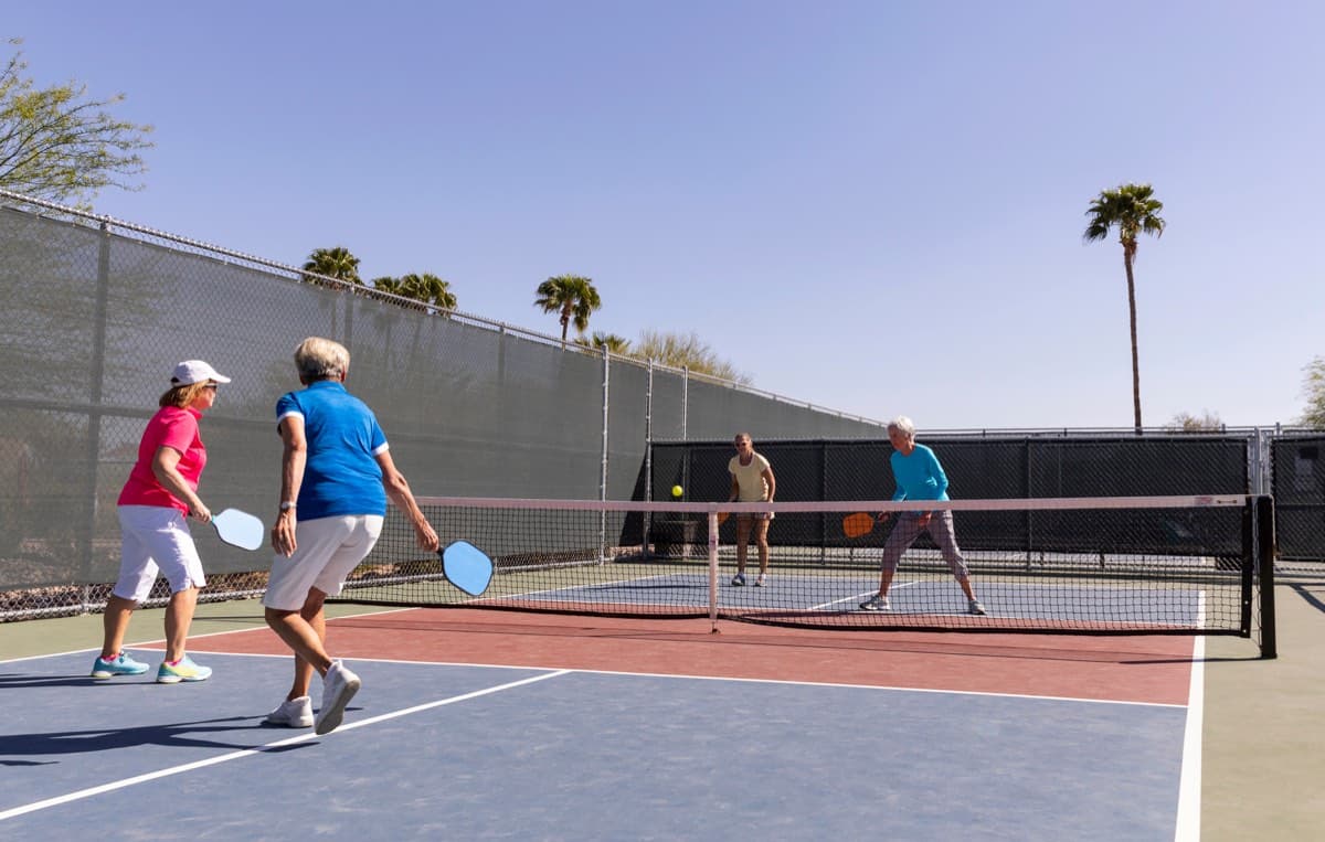 Pickleball players on an outdoor court